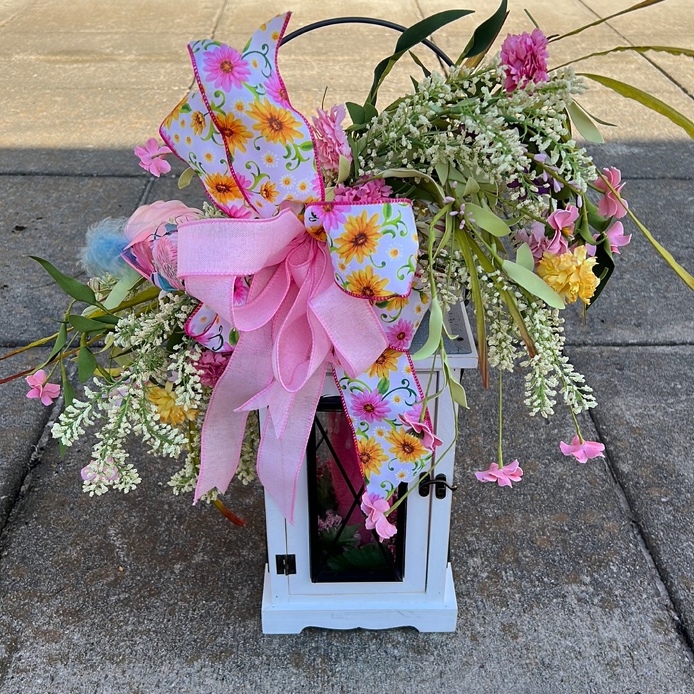 Hand made floral accent on a lantern handmade candle inside lantern